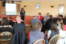 Melissa reports on FAP Gene's involvement with The Networking Project before splitting everyone into three groups.